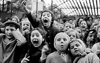 Alfred Eisenstaedt's 1963 photograph of children watching a puppet show in the Tuilieries